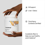 Person holding Thorne FiberMend beside a product information graphic