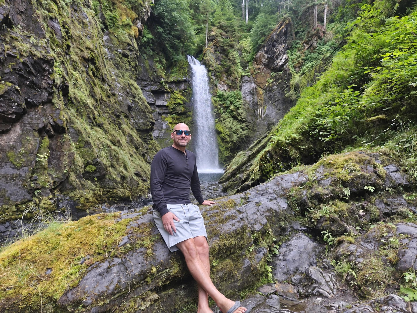 Preston beside a forest waterfall